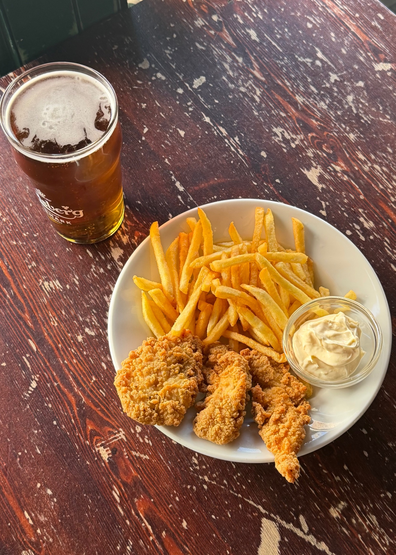 Crispy chicken with fries and a pint